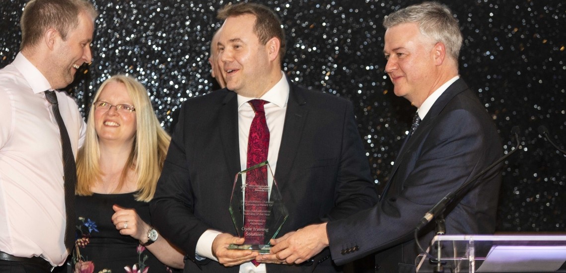 Left to right: Kris McDonald, Tammy Martin and Colin McMurray of Clyde Training Solutions receiving their award from Alan Whisker, Director of Client Operations, Ascensos